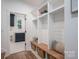 Bright mudroom featuring white shelving and a bench with wicker basket storage at 1062 Sage Pine Cir, Clover, SC 29710