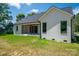 This home features a brick exterior with a covered patio and beautifully maintained green grass at 1062 Sage Pine Cir, Clover, SC 29710