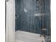 Modern shower with navy tile, bronze shower head, and a white shower curtain at 1062 Sage Pine Cir, Clover, SC 29710