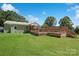 The backyard of this home is beautifully landscaped, with a wooden deck and plenty of space at 111 Berry St, Chester, SC 29706