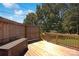 Wooden deck and fence offer a private outdoor living space with green trees at 111 Berry St, Chester, SC 29706