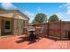 A comfortable outdoor seating area with a table and chairs on a red deck at 111 Berry St, Chester, SC 29706