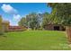 The huge backyard features a charming outbuilding and a spacious deck, perfect for entertaining at 111 Berry St, Chester, SC 29706