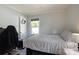 Relaxing bedroom featuring a soft, neutral color palette and a window with bright natural light at 111 Berry St, Chester, SC 29706