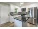 Modern kitchen with white cabinets, mosaic backsplash, stainless steel appliances and granite countertops at 111 Berry St, Chester, SC 29706