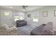 Inviting living room with hardwood floors, neutral walls, bright natural light, and ceiling fan at 111 Berry St, Chester, SC 29706
