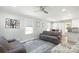 Cozy living room with neutral walls, ceiling fan, area rug, and bright natural light at 111 Berry St, Chester, SC 29706