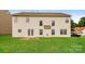 Spacious backyard featuring a large green lawn and back of the house at 11305 Erwin Ridge Ave, Charlotte, NC 28213