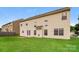 Spacious backyard featuring a large green lawn and back of the house at 11305 Erwin Ridge Ave, Charlotte, NC 28213
