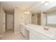 Bright bathroom with a double sink vanity, large mirror, and tiled floor at 11305 Erwin Ridge Ave, Charlotte, NC 28213