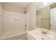 Bright bathroom featuring a tub and shower combination with sink at 11305 Erwin Ridge Ave, Charlotte, NC 28213