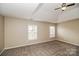 A spacious bedroom offers ample natural light and plush carpeting for ultimate comfort at 11305 Erwin Ridge Ave, Charlotte, NC 28213