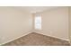 Bedroom with a neutral carpet, a window, and natural light at 11305 Erwin Ridge Ave, Charlotte, NC 28213