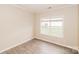 Bedroom with a large window and laminated floors at 11305 Erwin Ridge Ave, Charlotte, NC 28213