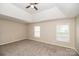 A spacious bedroom offers ample natural light and plush carpeting for ultimate comfort at 11305 Erwin Ridge Ave, Charlotte, NC 28213