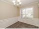 Comfortable dining room with hardwood floors, crown molding, and a large window at 11305 Erwin Ridge Ave, Charlotte, NC 28213