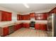Spacious kitchen with stainless steel appliances, granite countertops, and ample cabinet space at 11305 Erwin Ridge Ave, Charlotte, NC 28213