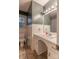 Bathroom features a white sink, patterned shower curtain, toilet, and a window for natural light at 1132 Arbor Dr, Salisbury, NC 28144