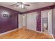 Bedroom features hardwood floors, doors, a closet and purple walls, providing potential for customization at 1132 Arbor Dr, Salisbury, NC 28144