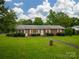 Charming brick home with a well-maintained front yard, mature landscaping, and inviting curb appeal at 1132 Arbor Dr, Salisbury, NC 28144