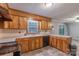 Efficient kitchen featuring wood cabinetry, stainless steel appliances, and linoleum flooring, perfect for cooking at 1132 Arbor Dr, Salisbury, NC 28144