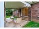 Cozy outdoor patio with seating, perfect for relaxing and entertaining with a brick exterior at 1132 Arbor Dr, Salisbury, NC 28144