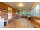 Spacious sunroom featuring brick walls, large windows, natural light, and access to the outdoors at 1132 Arbor Dr, Salisbury, NC 28144