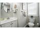 Bright bathroom featuring a modern vanity, and updated fixtures and lighting at 11359 Deer Ridge Ln, Charlotte, NC 28277
