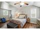 Cozy bedroom featuring an updated ceiling fan and ample natural light at 11359 Deer Ridge Ln, Charlotte, NC 28277