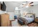Cozy bedroom featuring an updated ceiling fan and ample natural light at 11359 Deer Ridge Ln, Charlotte, NC 28277