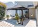 Relaxing backyard featuring a patio, a gazebo with outdoor seating, and lush greenery at 115 Morrocroft Ln, Mooresville, NC 28117