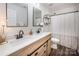 Bathroom with double sink vanity, framed mirrors, and shower with curtain at 115 Morrocroft Ln, Mooresville, NC 28117