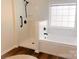 Bright bathroom features a walk-in shower and a soaking tub, complemented by a neutral color palette at 115 Morrocroft Ln, Mooresville, NC 28117