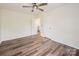 Spacious bedroom boasts hardwood floors and a ceiling fan, offering comfort and style at 115 Morrocroft Ln, Mooresville, NC 28117