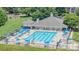 Aerial view of community pool, featuring lounging areas, umbrellas, and a clubhouse at 115 Morrocroft Ln, Mooresville, NC 28117