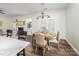Cozy dining area with a round table, four chairs, and a view of the fireplace at 115 Morrocroft Ln, Mooresville, NC 28117