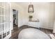 Bright dining room with modern light fixture, wainscoting, and doorway to the kitchen at 115 Morrocroft Ln, Mooresville, NC 28117
