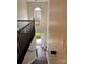 Bright entryway featuring dark hardwood floors, an elegant chandelier, and black banister at 115 Morrocroft Ln, Mooresville, NC 28117