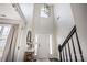 Grand entryway with soaring ceilings, a modern chandelier, and a view of the staircase at 115 Morrocroft Ln, Mooresville, NC 28117