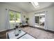 Sunlit room showcases hardwood floors, a sliding door to the backyard, and natural light at 115 Morrocroft Ln, Mooresville, NC 28117