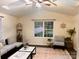 Bright living room with high ceilings, ceiling fan, lots of natural light, and a decorative rug at 115 Morrocroft Ln, Mooresville, NC 28117
