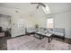 Bright living room with vaulted ceilings, a skylight, and modern decor create an inviting space at 115 Morrocroft Ln, Mooresville, NC 28117