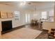 Inviting living room and dining area featuring a fireplace and an open kitchen, perfect for gatherings and relaxation at 115 Morrocroft Ln, Mooresville, NC 28117