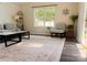 Inviting living room with large windows and light-colored walls, providing natural light and an airy feel at 115 Morrocroft Ln, Mooresville, NC 28117