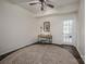 Bright office space features hardwood floors, a ceiling fan, and a door to the backyard at 115 Morrocroft Ln, Mooresville, NC 28117