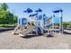 Community playground area with colorful slides, climbing structures, and a soft, safe play surface at 115 Morrocroft Ln, Mooresville, NC 28117
