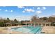 Stunning pool area with crystal-clear water and a covered seating area for relaxation and social gatherings at 115 Morrocroft Ln, Mooresville, NC 28117