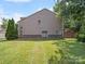 Large backyard with a lush green lawn, and neutral siding at 1169 Stuarts Landing Dr, Cramerton, NC 28032