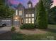 Charming two-story home with stone accents, attached garage, and manicured landscaping at 1169 Stuarts Landing Dr, Cramerton, NC 28032