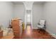 Hallway with hardwood floors and a window with shutters at 1169 Stuarts Landing Dr, Cramerton, NC 28032